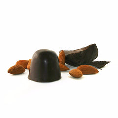 Bonbon with almonds for scale